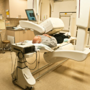 radiotherapy centre - male patient lying down under a gamma camera