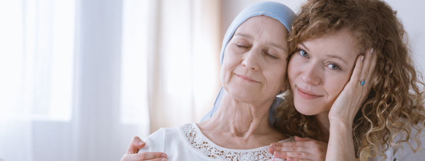 radiotherapy centre - daughter supporting her sick mother