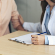 provide support and assistance - Woman doctor holding hands