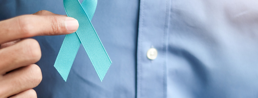 Amethyst Radiotherapy - Man holding light Blue Ribbon