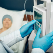 Private chemotherapy treatment - Oncologist turning on device IV drip chemotherapy