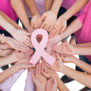 Radiotherapy Treatment - Hands joined in circle holding breast cancer struggle symbol