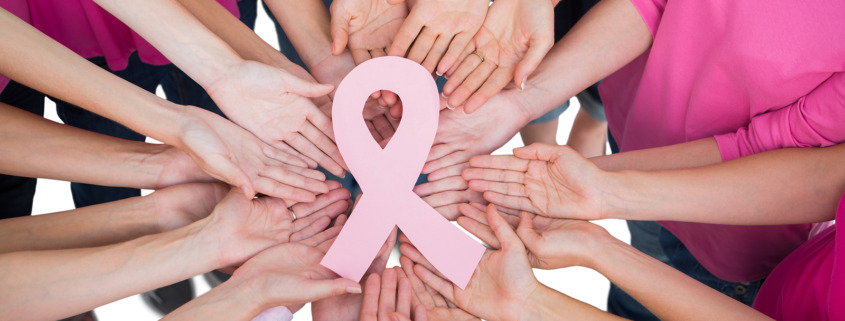 Radiotherapy Treatment - Hands joined in circle holding breast cancer struggle symbol